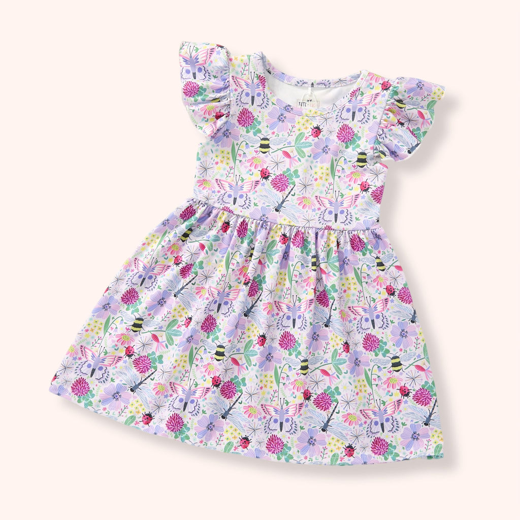 Lightweight summer girl dress with floral print and ruffle sleeves, perfect for playful sunny days.